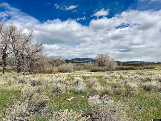 property view of mountains featuring a rural view