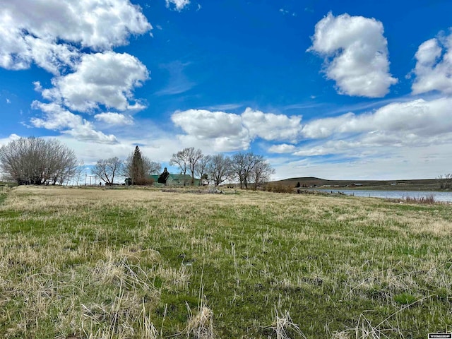 view of yard with a rural view