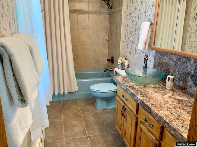 full bathroom featuring tile flooring, shower / bath combination with curtain, large vanity, and toilet