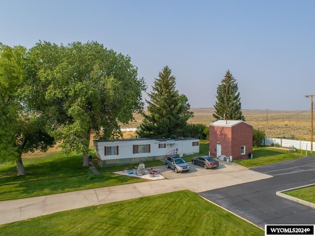 bi-level home with a front lawn