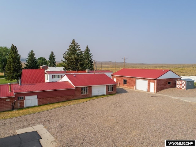 view of front of house with an outdoor structure and a garage