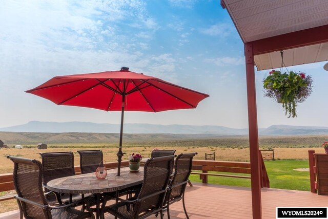 deck with a mountain view and a rural view