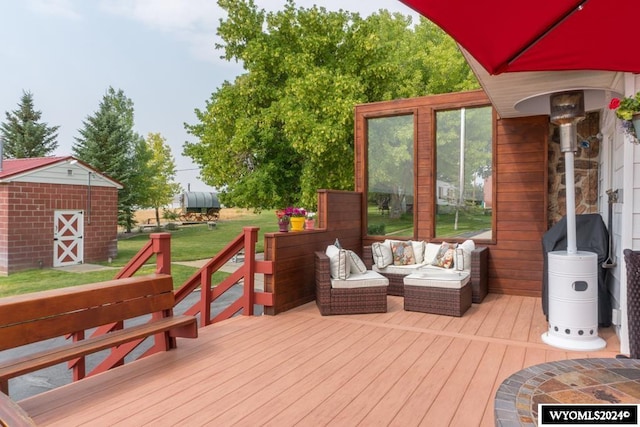 wooden terrace with a shed and an outdoor living space