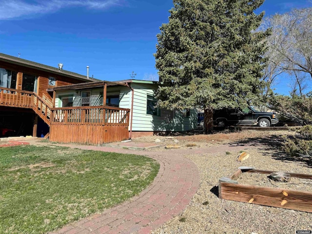 view of yard featuring a wooden deck