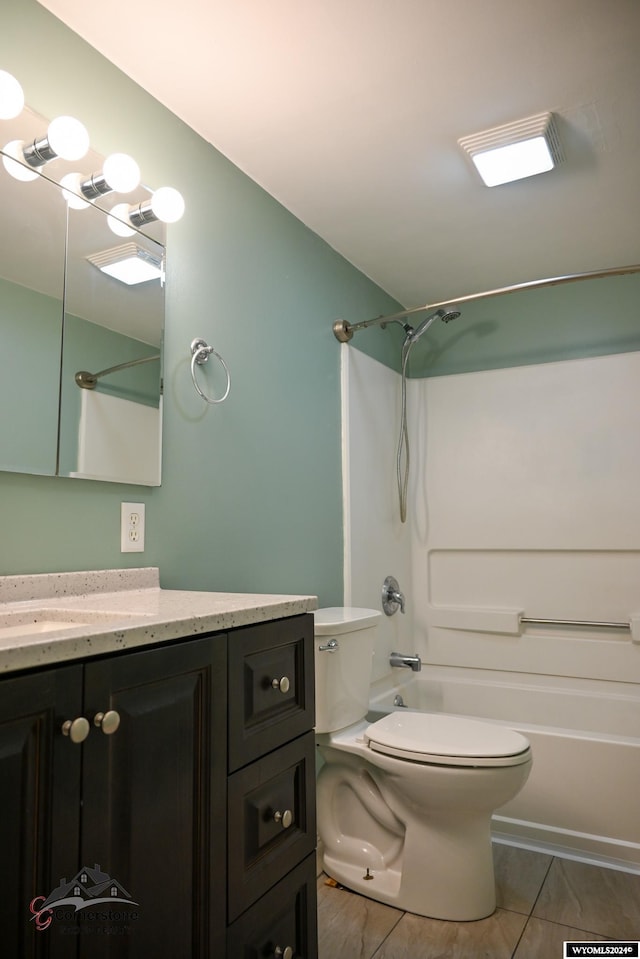 full bathroom featuring toilet, vanity, and bathtub / shower combination