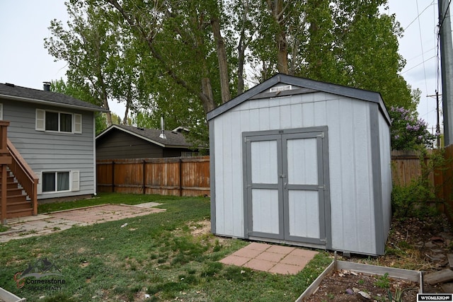 view of outbuilding with a yard