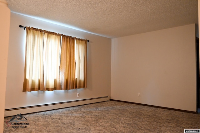 unfurnished room featuring a baseboard heating unit, carpet floors, and a textured ceiling