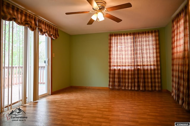 empty room featuring hardwood / wood-style floors and ceiling fan