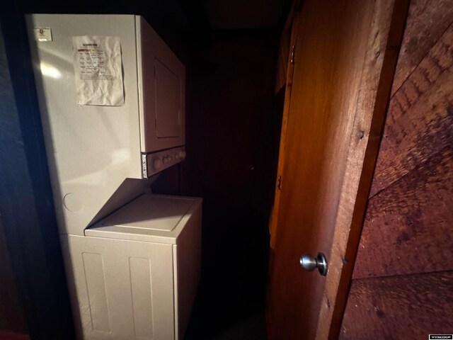 laundry area featuring stacked washer and clothes dryer