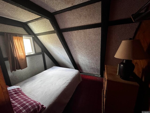 bedroom featuring lofted ceiling