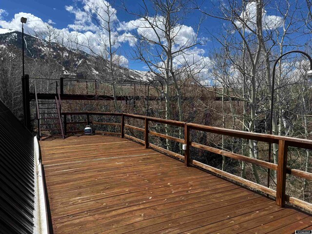 wooden deck featuring a mountain view