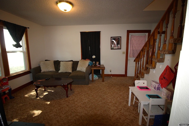 living room with carpet flooring and a textured ceiling