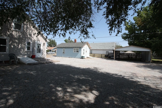 rear view of house with a carport