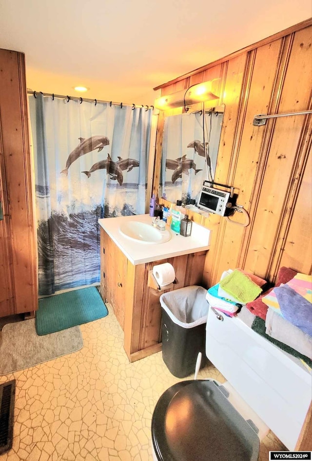 bathroom featuring tile patterned flooring and vanity