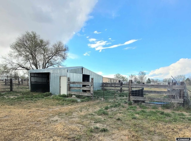 view of outbuilding with a rural view