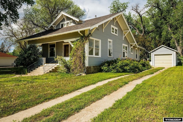 bungalow-style home featuring a front yard, a porch, a garage, and an outdoor structure