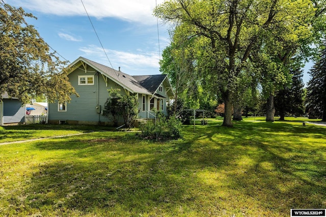 view of property exterior with a lawn