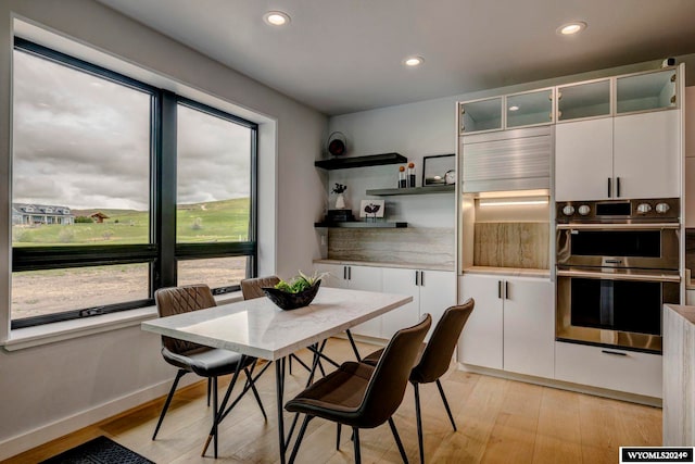 dining room featuring light hardwood / wood-style flooring