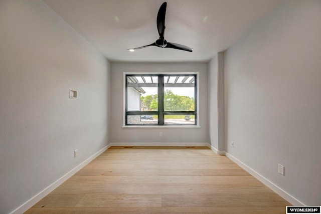 spare room with light hardwood / wood-style floors and ceiling fan