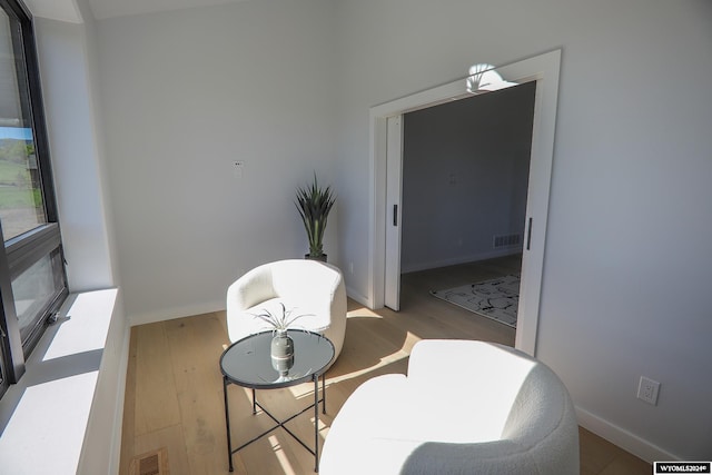 dining space with hardwood / wood-style floors