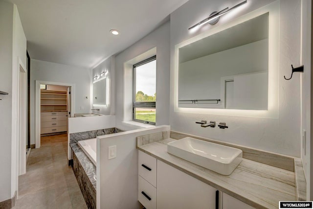 bathroom featuring tile floors and large vanity