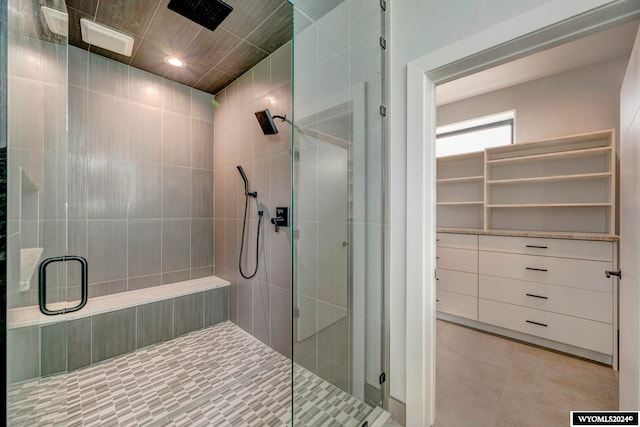 bathroom with tile floors and an enclosed shower