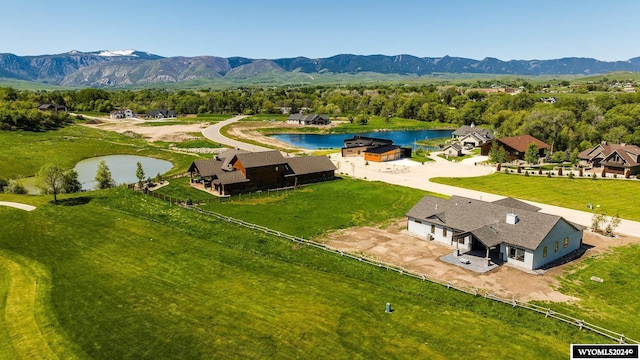 birds eye view of property featuring a water and mountain view