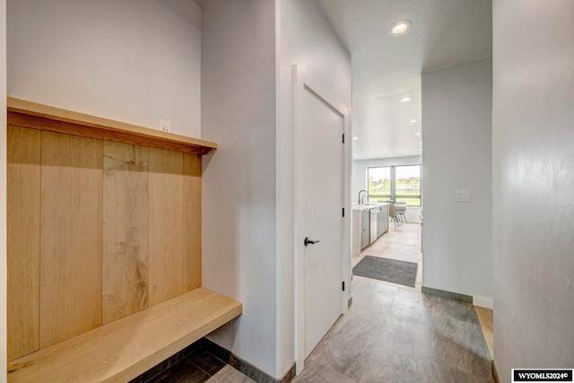 mudroom with light tile floors