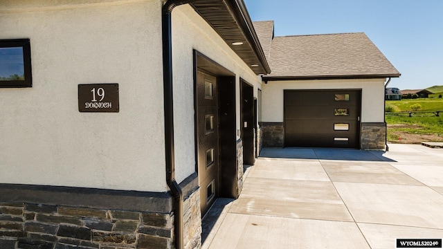 view of side of property with a garage