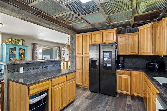 kitchen with tasteful backsplash, stainless steel fridge, dishwasher, and dark hardwood / wood-style floors