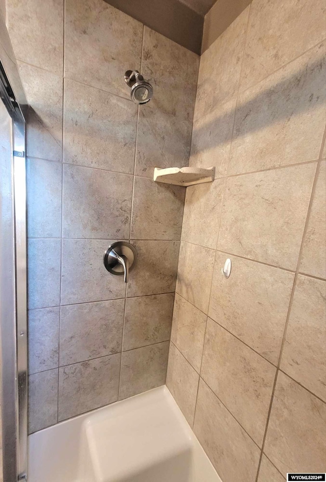 bathroom with tiled shower