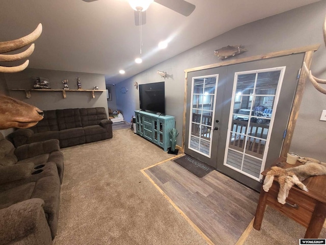 living room featuring carpet, french doors, ceiling fan, and lofted ceiling