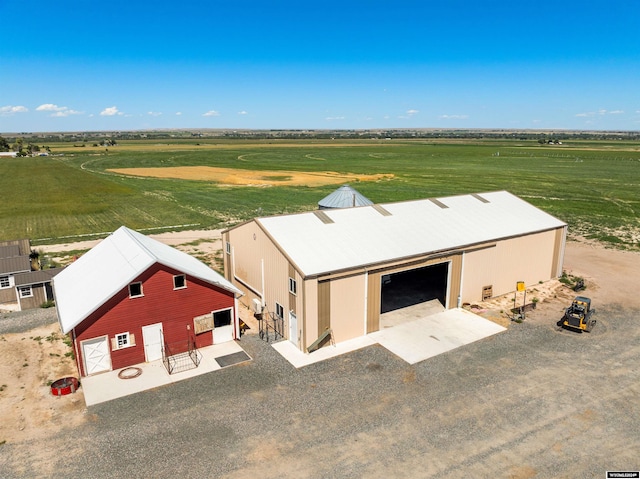 birds eye view of property with a rural view