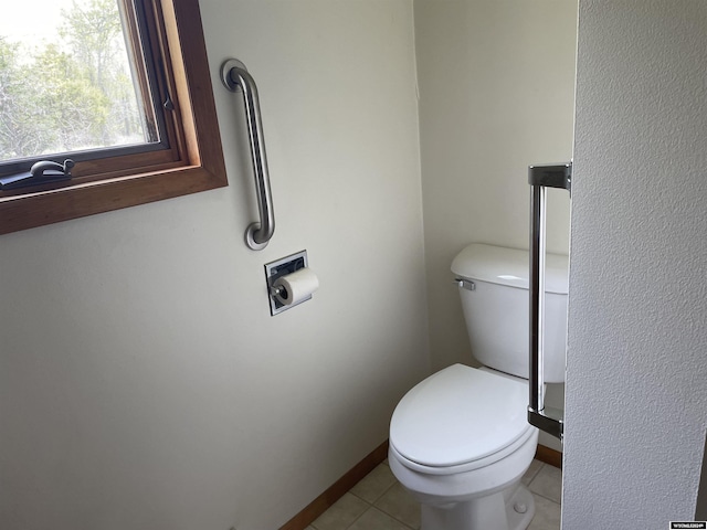 bathroom featuring tile patterned floors and toilet