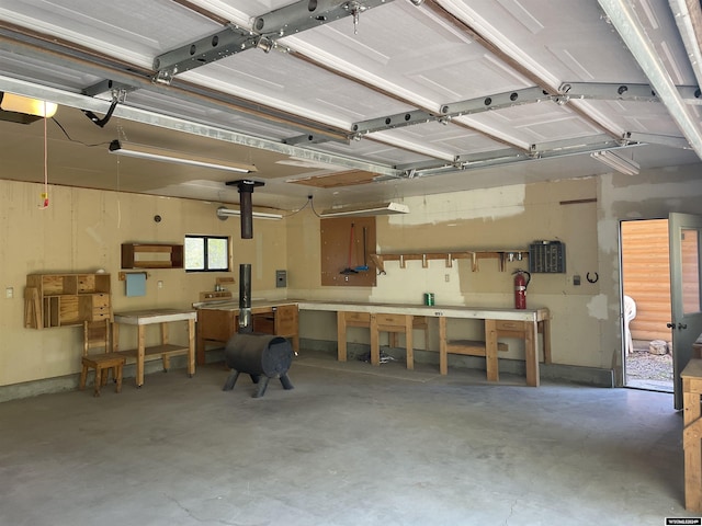 garage featuring a workshop area and a garage door opener