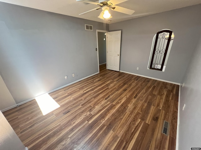 4012 Prestwick Pl, Riverton, WY 82501 - unfurnished bedroom featuring wood finished floors, a ceiling fan, and arched walkways