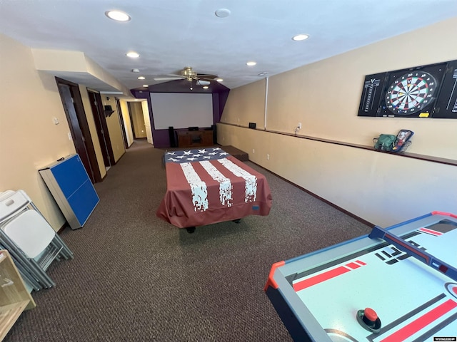 recreation room featuring ceiling fan and dark carpet