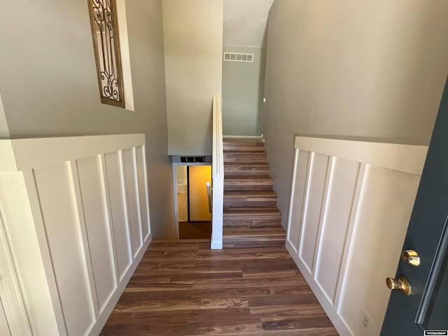 stairway with wood-type flooring