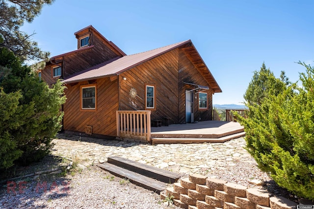 rear view of house with a deck