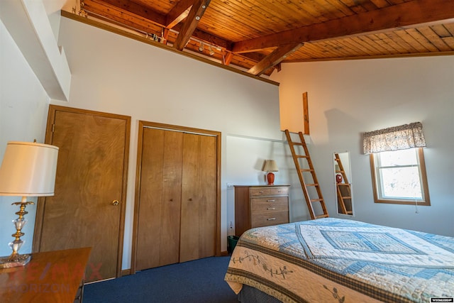 bedroom featuring carpet flooring, beam ceiling, wood ceiling, and a closet