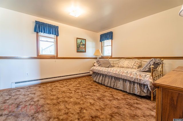 bedroom with carpet flooring, multiple windows, and baseboard heating