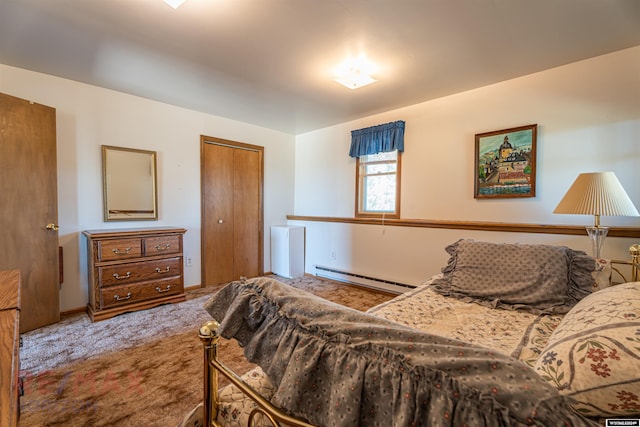 bedroom featuring baseboard heating, a closet, and carpet floors