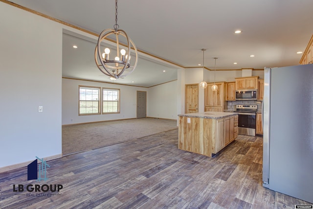 kitchen with light brown cabinetry, a center island, hanging light fixtures, stainless steel appliances, and light stone countertops