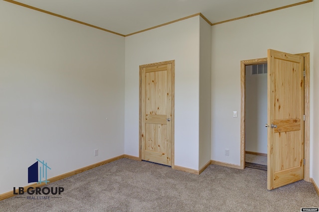 unfurnished bedroom with light carpet and ornamental molding