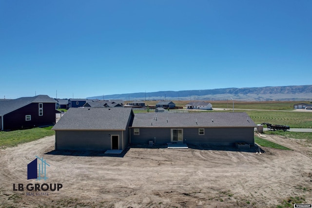 rear view of property with a mountain view