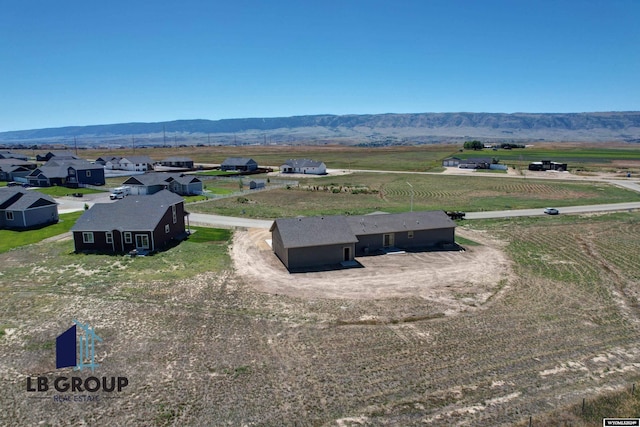 bird's eye view featuring a mountain view and a rural view