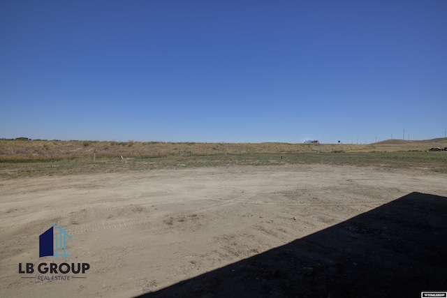 view of yard with a rural view