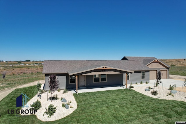 ranch-style house featuring a patio and a front yard