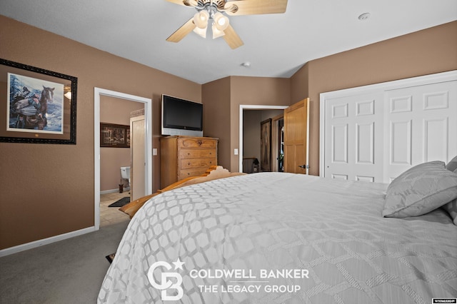 carpeted bedroom featuring ceiling fan, ensuite bath, and a closet