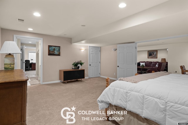 bedroom featuring light colored carpet